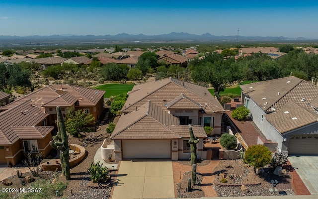 birds eye view of property with a mountain view