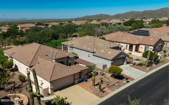 birds eye view of property featuring a mountain view