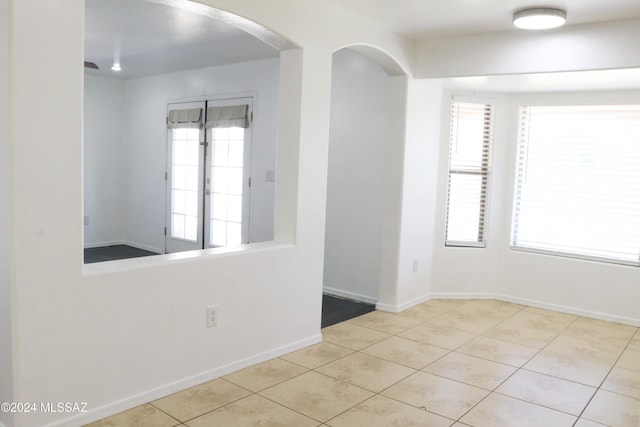 empty room with light tile patterned flooring