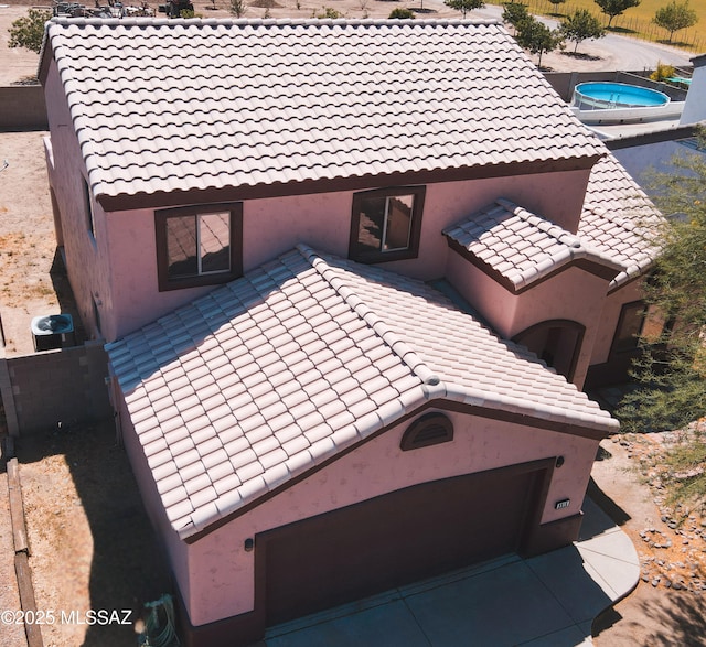 2215 S Lamonica Way, Safford, AZ 85546 - view of home's exterior featuring a tile roof, stucco siding, and cooling unit