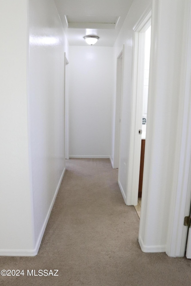 2215 S Lamonica Way, Safford, AZ 85546 - corridor with light colored carpet, attic access, and baseboards