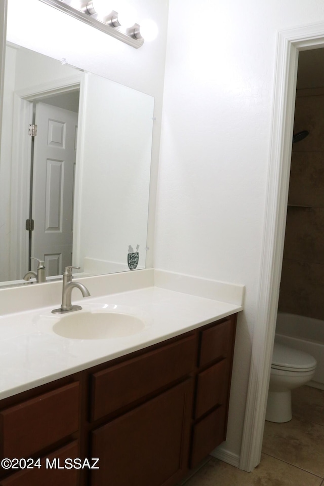 bathroom featuring tile patterned floors, vanity, and toilet