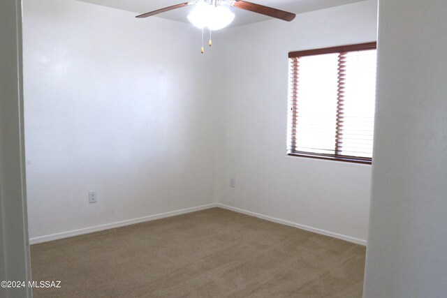 2215 S Lamonica Way, Safford, AZ 85546 - carpeted empty room featuring ceiling fan and baseboards