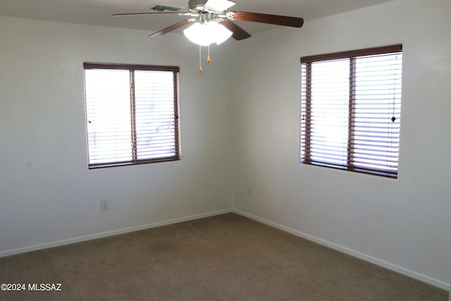 empty room with carpet and ceiling fan