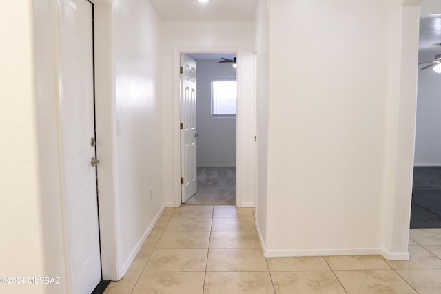 corridor with light tile patterned flooring