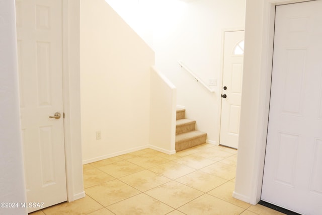 stairway featuring tile patterned floors