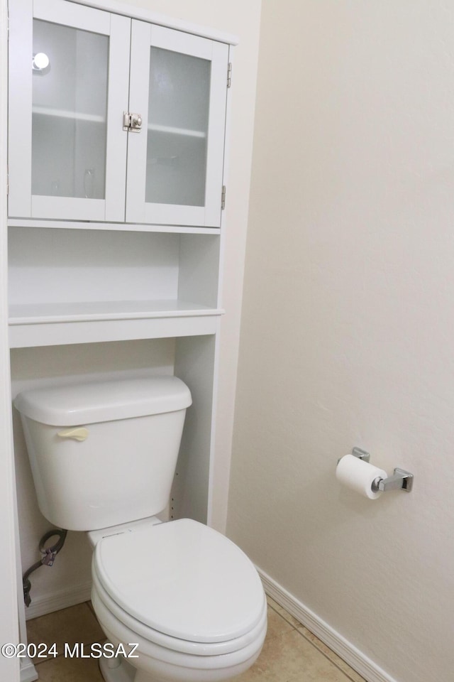 bathroom featuring tile patterned floors and toilet