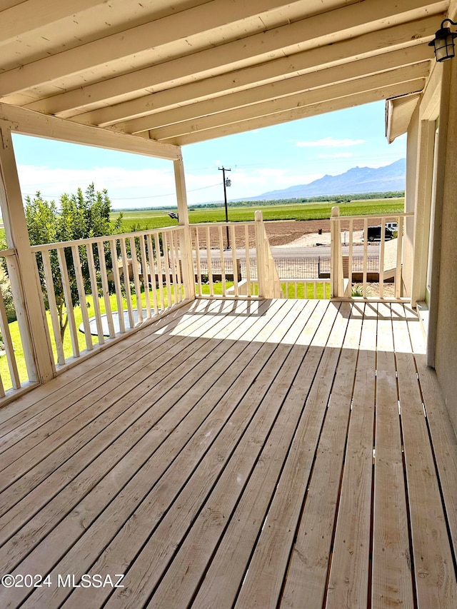 wooden terrace featuring a mountain view