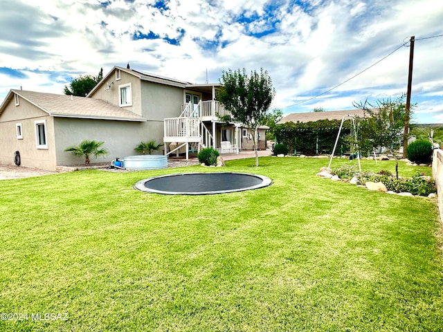 rear view of house with a yard