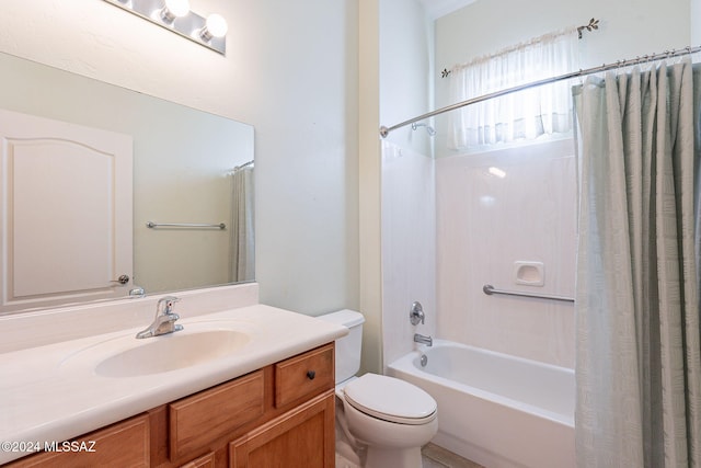 full bathroom with vanity, shower / bath combination with curtain, and toilet