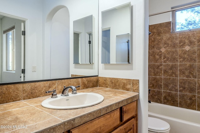 full bathroom with shower / bathing tub combination, vanity, and toilet