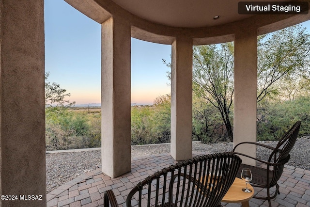 view of patio terrace at dusk