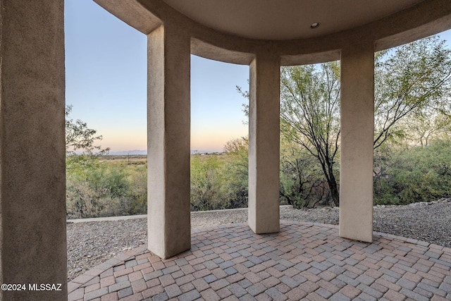 view of patio terrace at dusk