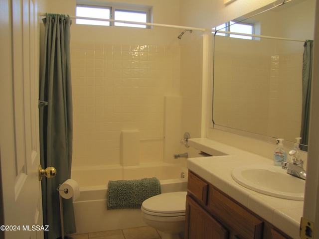 full bathroom featuring shower / bathtub combination with curtain, tile patterned flooring, vanity, and toilet