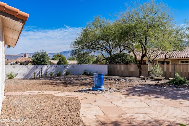 view of patio / terrace featuring a mountain view