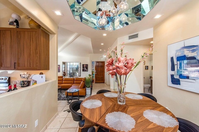 dining space featuring light tile patterned flooring