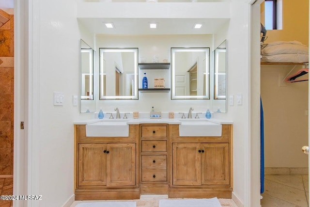 bathroom with tile patterned floors and vanity