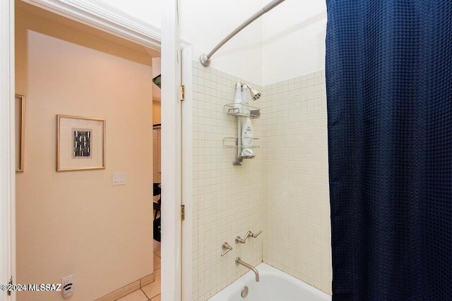 bathroom with tile patterned floors and shower / bathtub combination with curtain