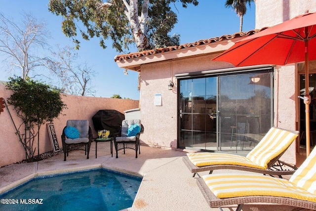 view of pool featuring a patio area