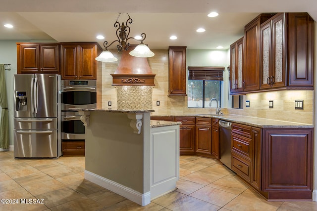 kitchen with a kitchen island, stainless steel appliances, sink, a notable chandelier, and pendant lighting