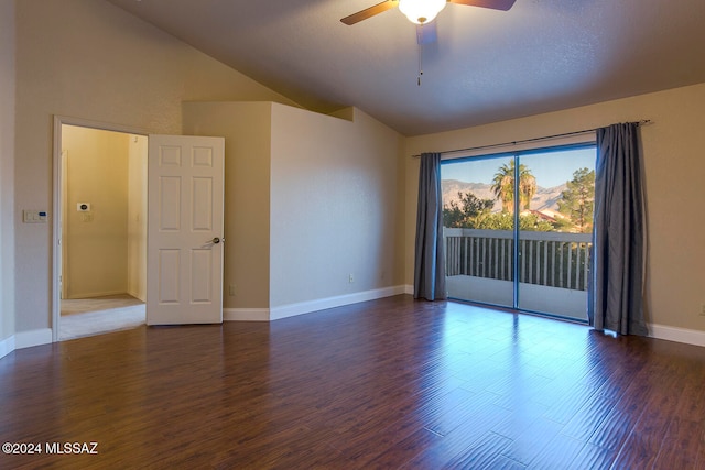 unfurnished room featuring dark wood-type flooring, high vaulted ceiling, and ceiling fan