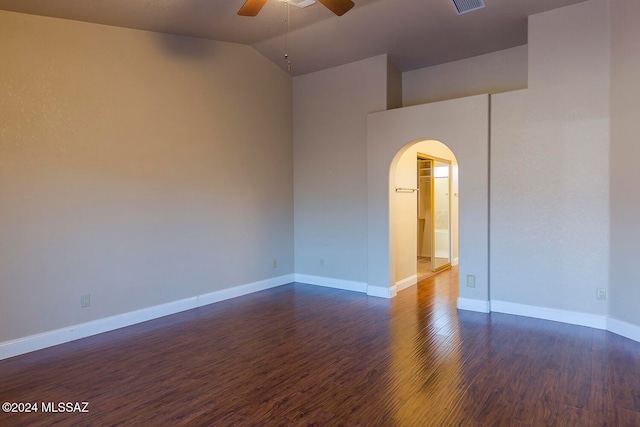 unfurnished room featuring dark wood-type flooring, ceiling fan, and lofted ceiling