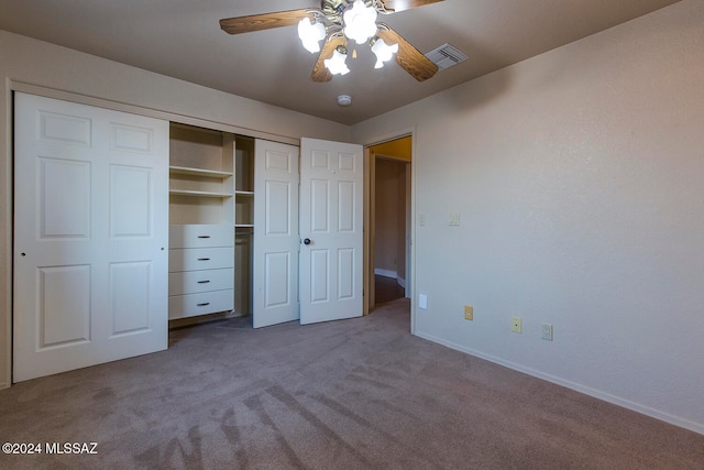 unfurnished bedroom featuring a closet, ceiling fan, and carpet flooring