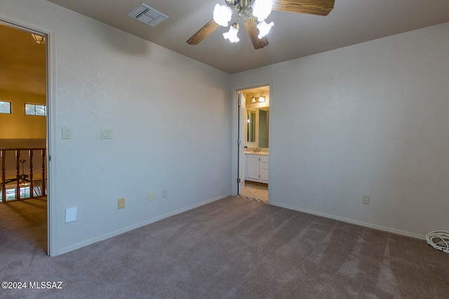 carpeted empty room with ceiling fan