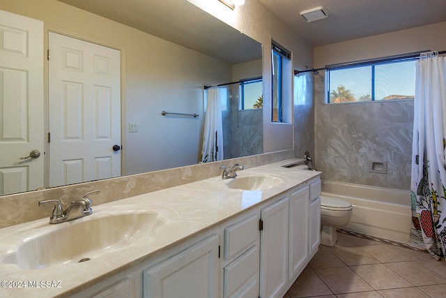 full bathroom with vanity, toilet, tile patterned floors, and shower / tub combo