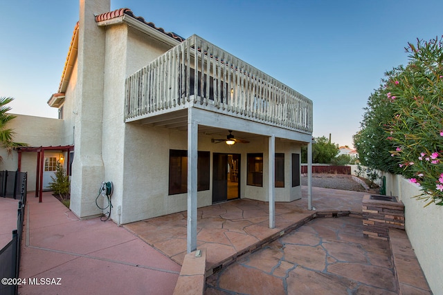 back of property with a patio