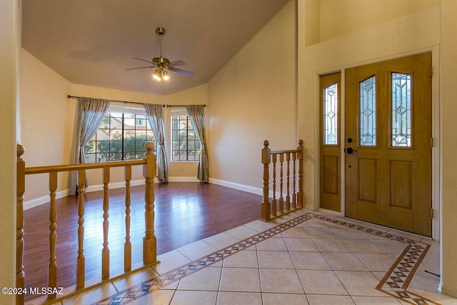 entryway featuring ceiling fan, lofted ceiling, and light wood-type flooring