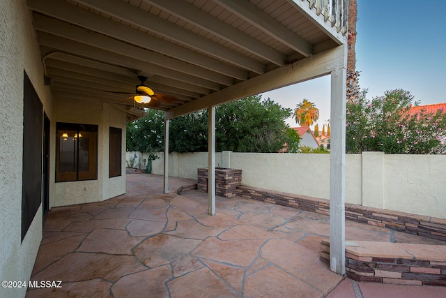 view of patio featuring ceiling fan