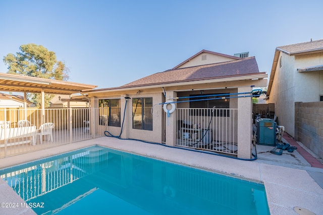 view of pool featuring central AC and a patio area