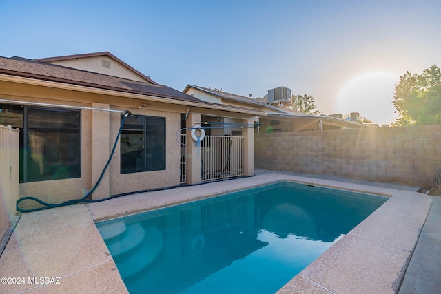 view of pool featuring central AC unit