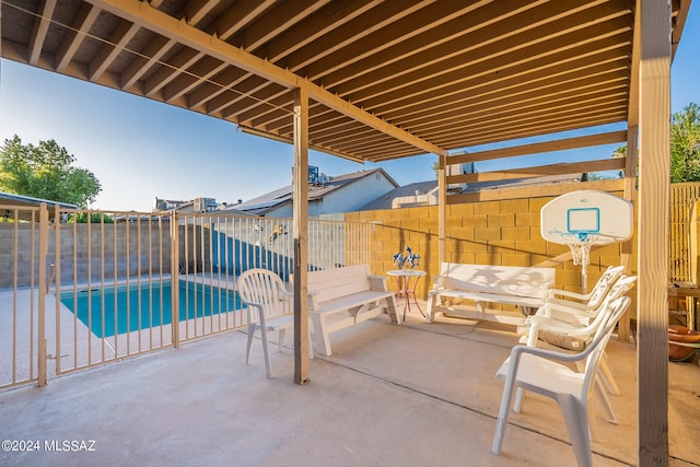 view of patio with a fenced in pool