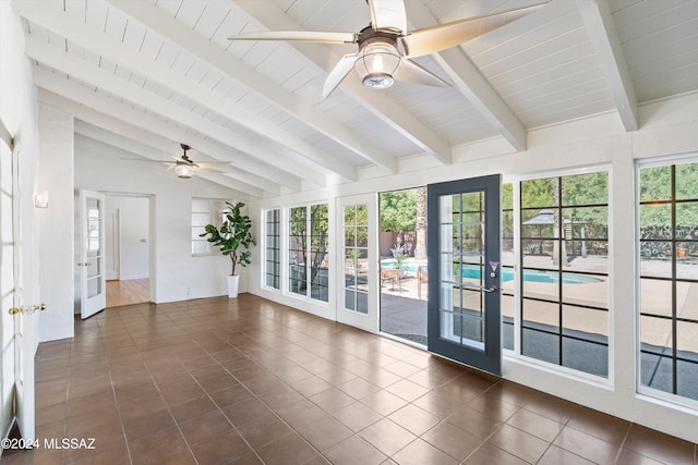 unfurnished sunroom with vaulted ceiling with beams, ceiling fan, and french doors