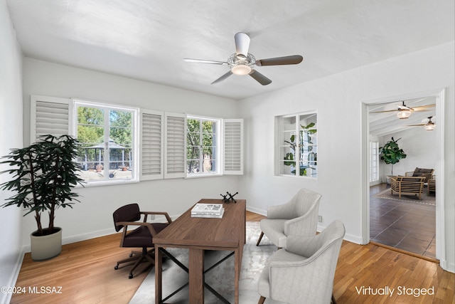 office space with light hardwood / wood-style flooring and ceiling fan