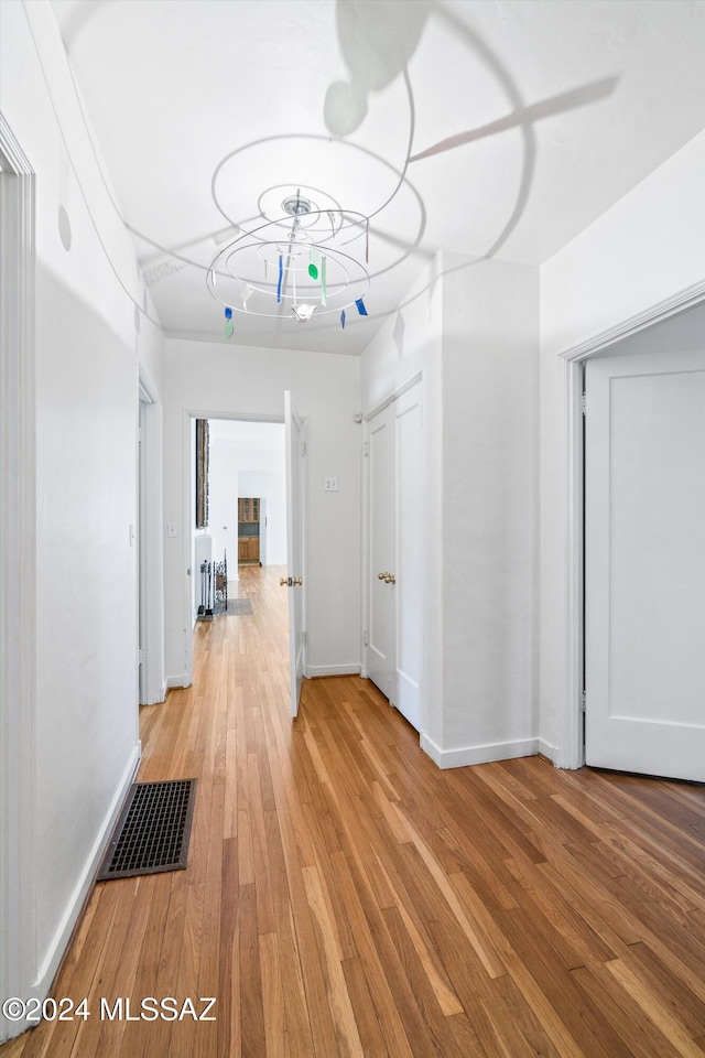 hall with light wood-type flooring