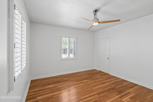 spare room with hardwood / wood-style flooring and ceiling fan