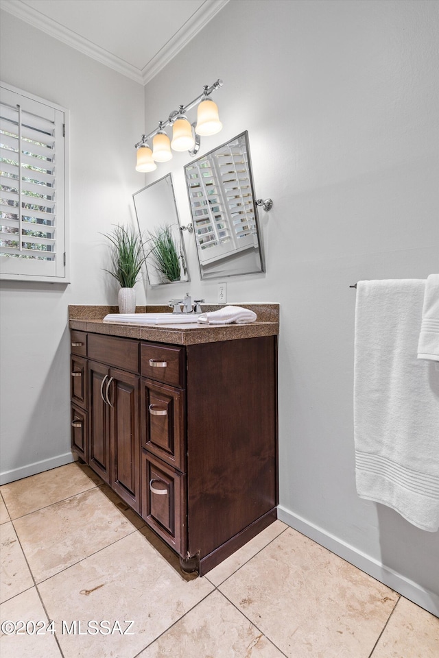 bathroom featuring tile patterned flooring, vanity, and ornamental molding