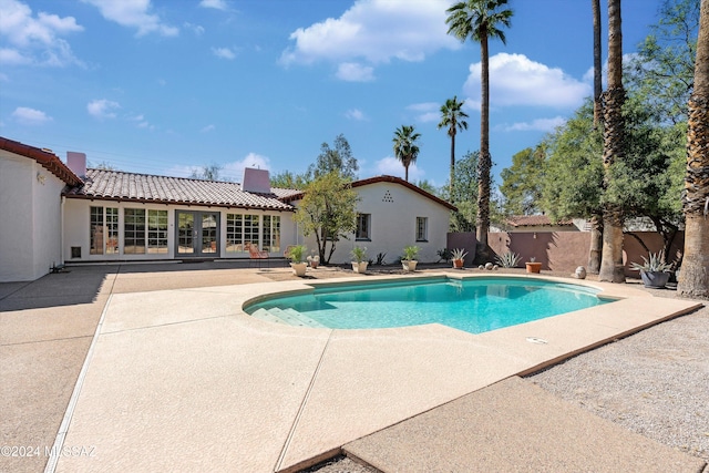 view of swimming pool with a patio area