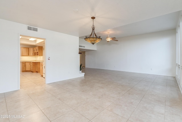 unfurnished living room featuring visible vents and light tile patterned flooring