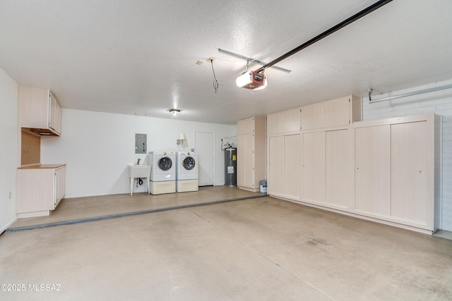 garage with electric panel, a garage door opener, washer and dryer, water heater, and a sink