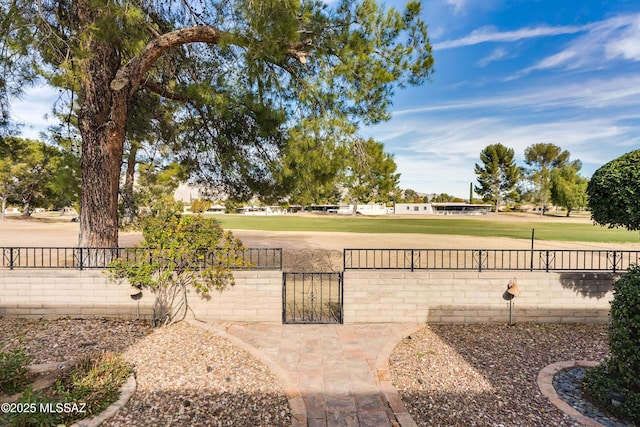 exterior space featuring fence private yard and a gate