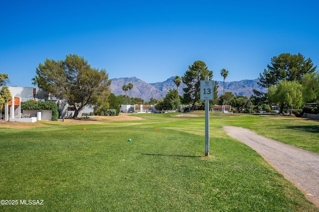 view of home's community featuring a mountain view and a yard