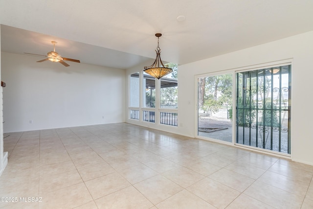 unfurnished room with light tile patterned floors and a ceiling fan