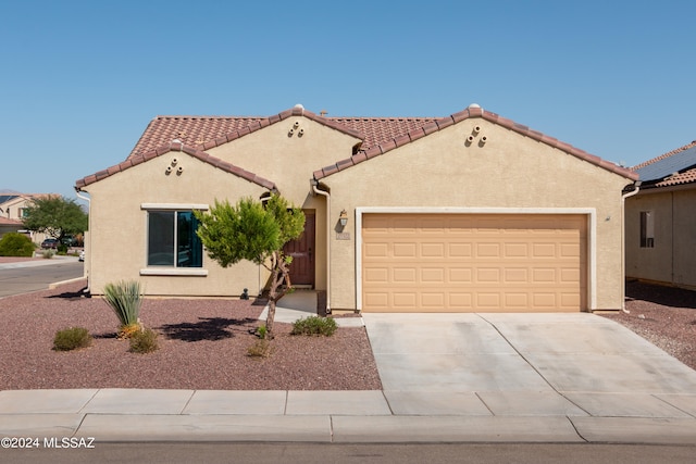 mediterranean / spanish-style house featuring a garage