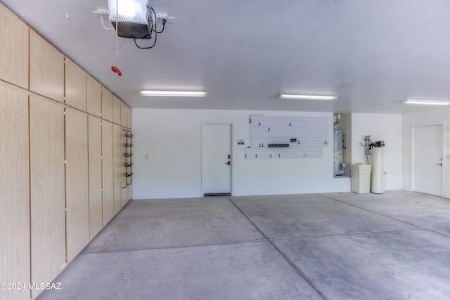 garage featuring a garage door opener and gas water heater