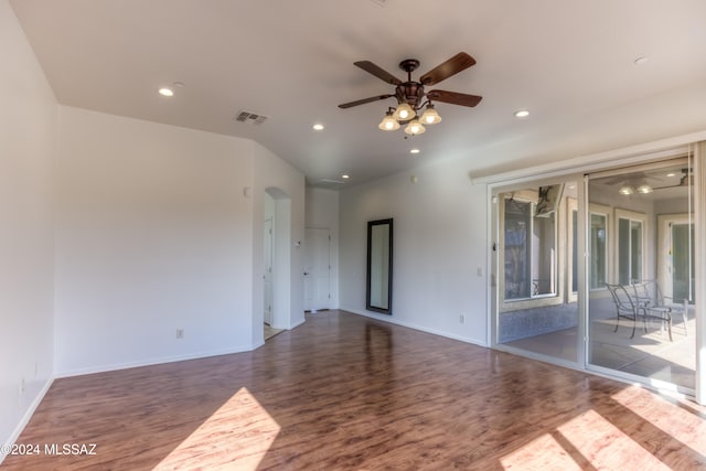 unfurnished room featuring ceiling fan and dark hardwood / wood-style flooring