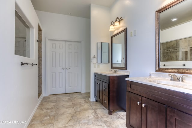 bathroom with vanity and a shower